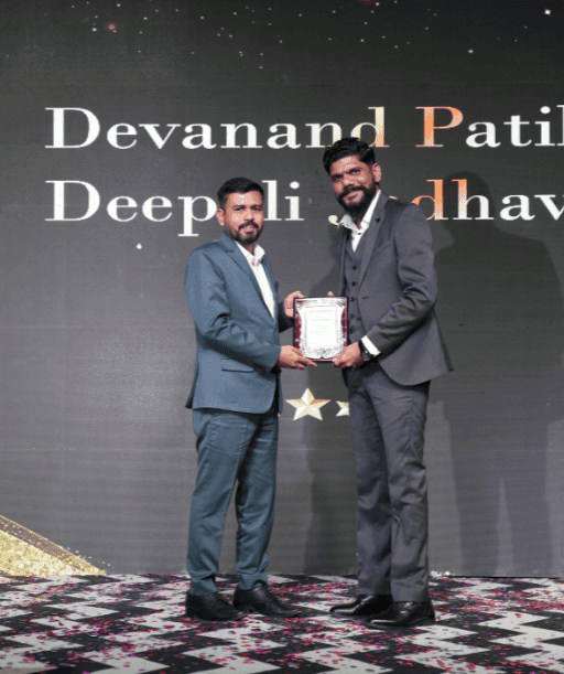 Devanand Patil and Deepali Jadhav receiving award