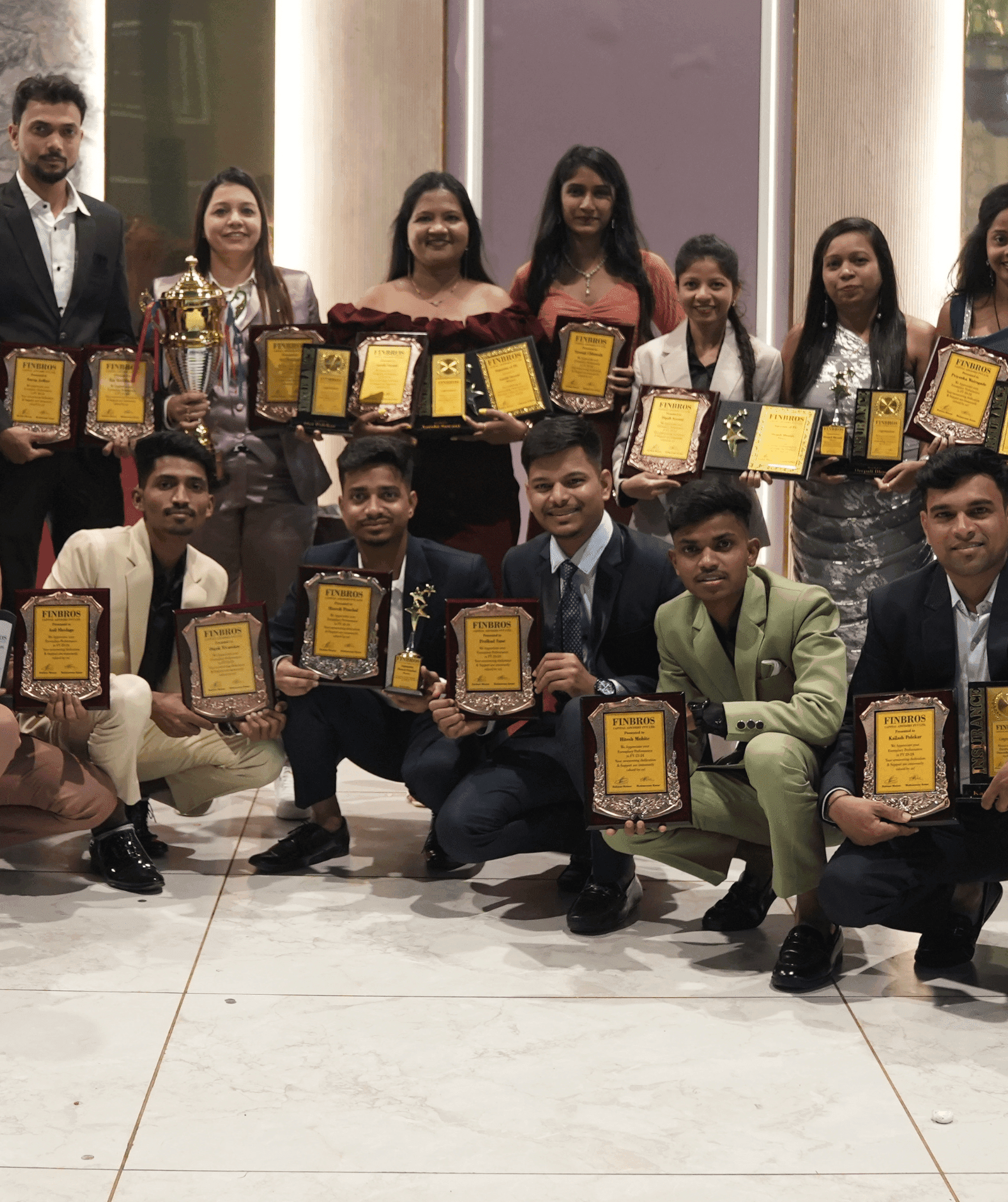 Team photo with awards
